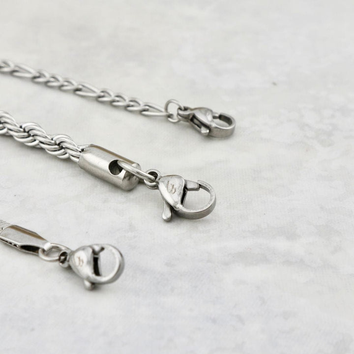 Trio de bracelets La Force en acier inoxydable Mathieu Blanchard Bracelets Acier inoxydable PTRM13022S Trio de bracelets Torsade - Figaro en acier inoxydable - unisexe Mathieu Blanchard Joaillerie